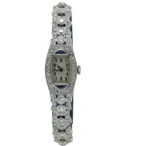OMEGA VINTEGE DAME PLATINE 950 ET OR GRIS 18K SERTIE D'ENVIRON 7 CTS DE DIAMANTS ET SAPHIR 14X29MM