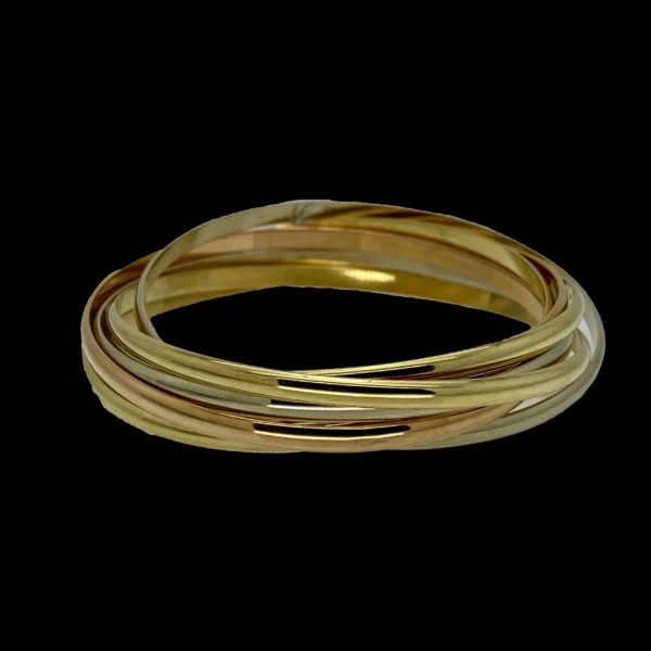 BRACELETS CARTIER TRINITY SEMAINIER 7 ANNEAUX ENTRELACES OR GRIS, JAUNE ET ROSE 18K/750 VINTAGE