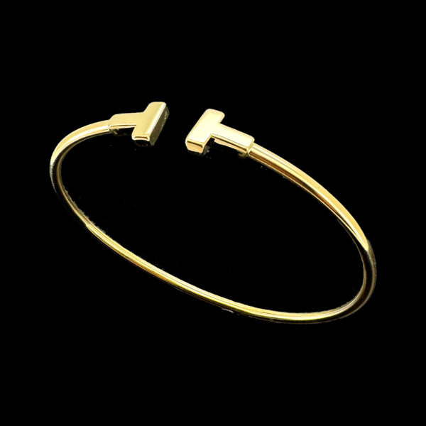 BRACELET TIFFANY "T" ÉTROIT WIRE OR JAUNE 18 CARATS